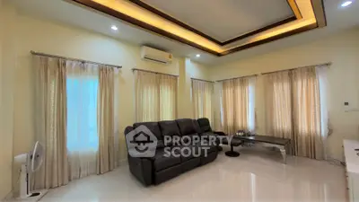 Spacious living room with elegant lighting and comfortable seating