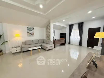 Spacious modern living room with elegant decor and ample natural light