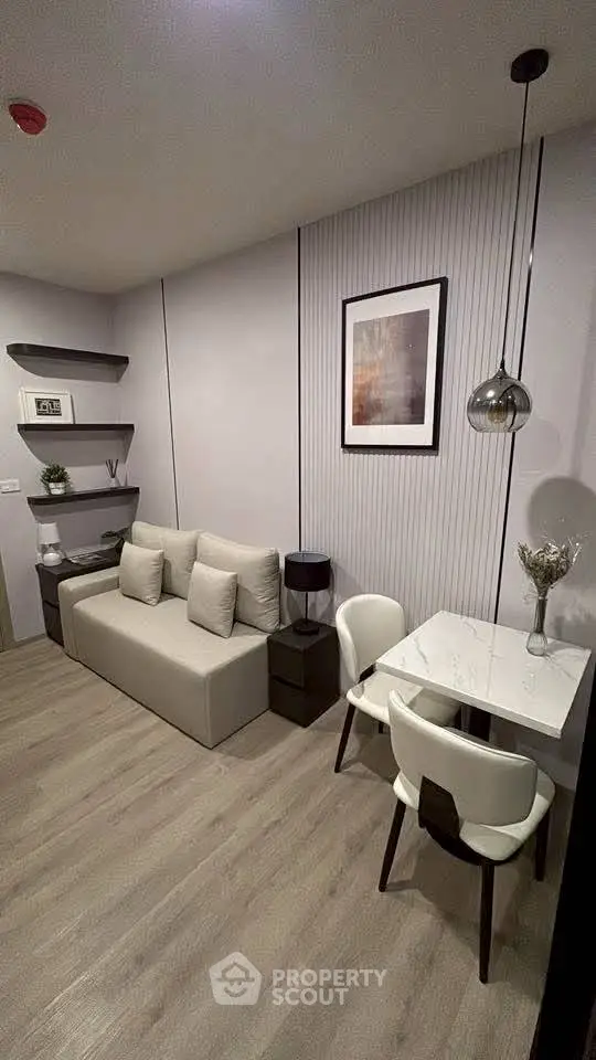 Modern living room with sleek furniture and stylish decor, perfect for urban living.