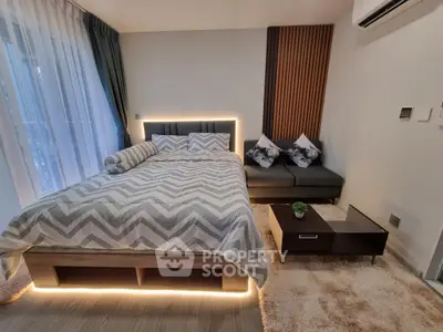 Modern bedroom with stylish lighting and cozy decor