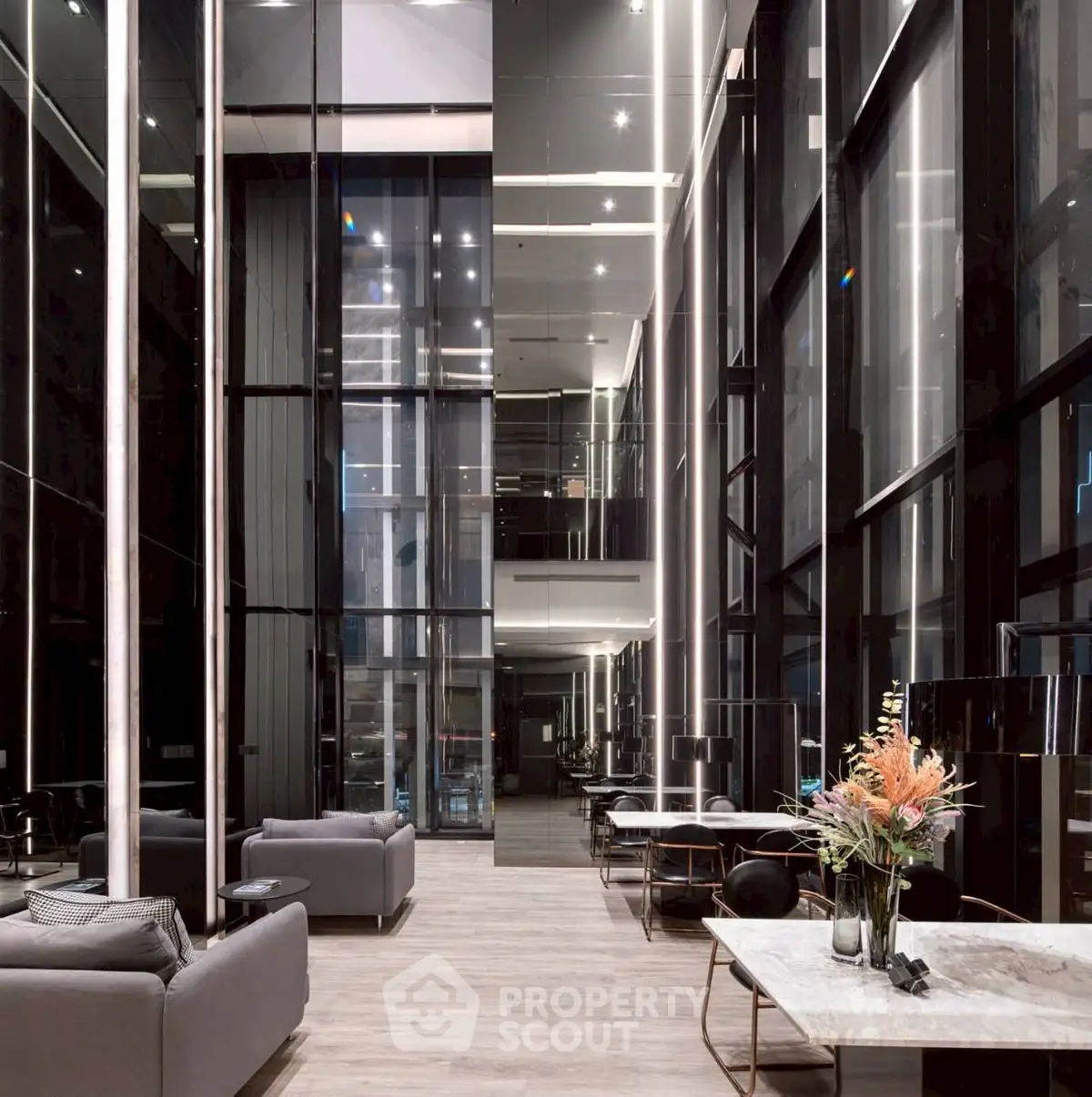 Luxurious modern building lobby with high ceilings and elegant decor