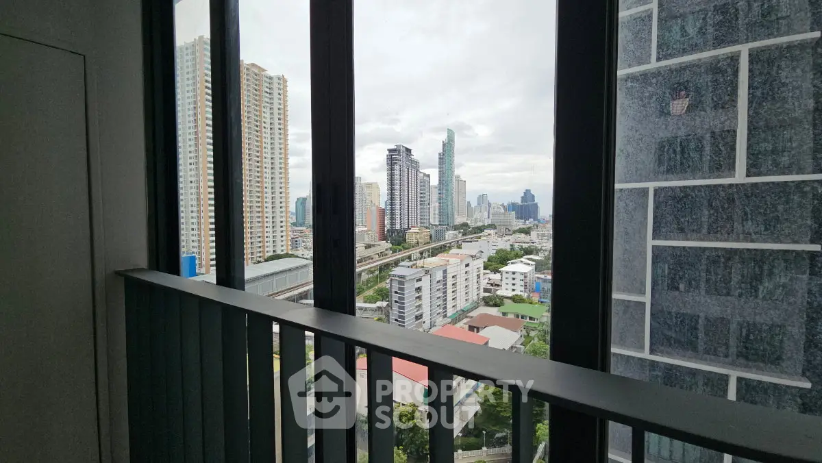 Stunning cityscape view from a high-rise balcony, showcasing modern urban living.