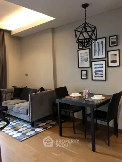 Stylish modern living room with cozy dining area and geometric lighting
