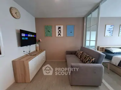 Modern living room with stylish decor and cozy sofa in open-plan apartment