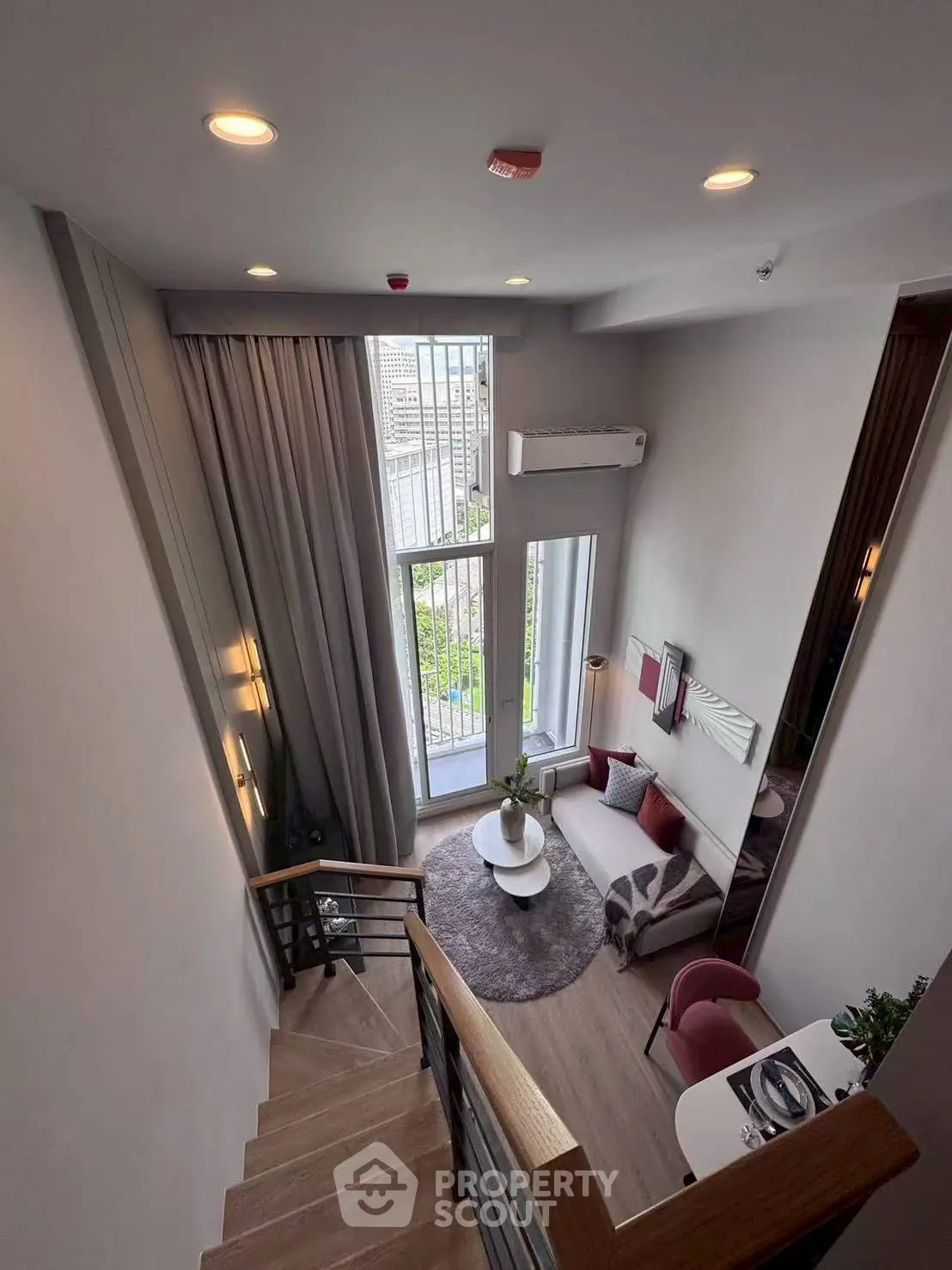 Modern duplex living room with high ceilings and stylish decor