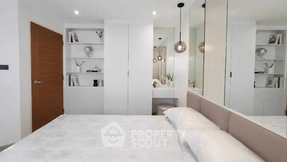 Modern bedroom with built-in wardrobe and stylish decor