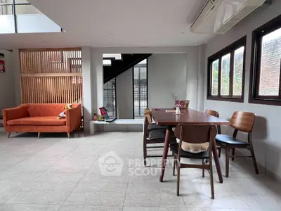 Modern living room with stylish furniture and ample natural light