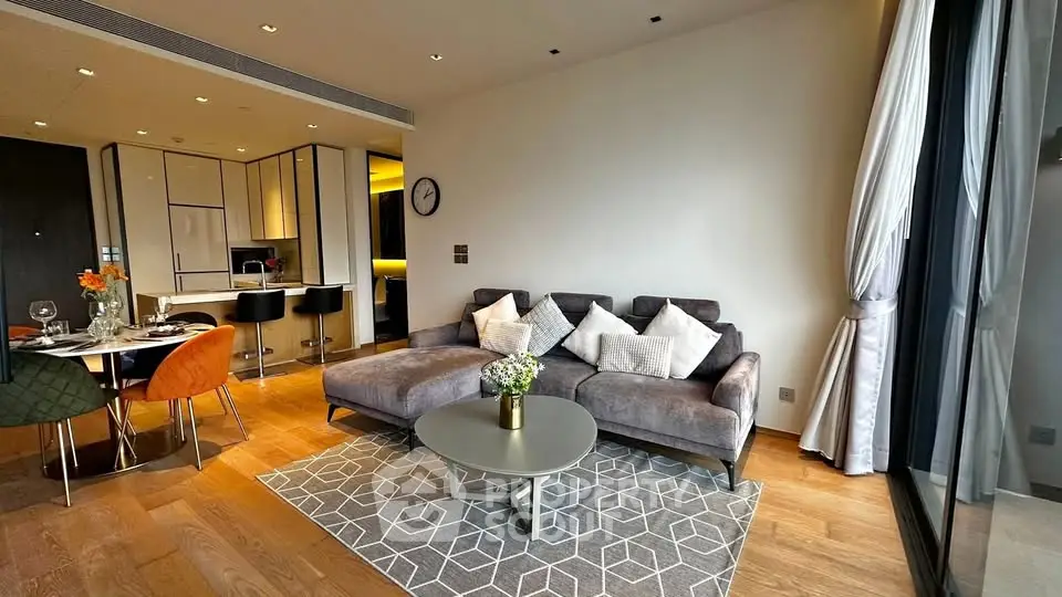 Modern living room with stylish decor and open kitchen layout in luxury apartment