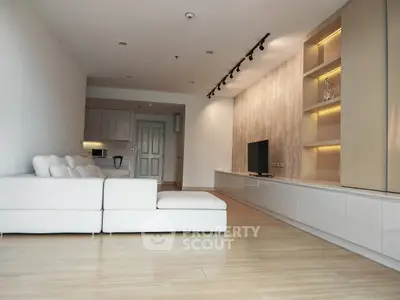 Spacious modern living room with sleek design and built-in shelving