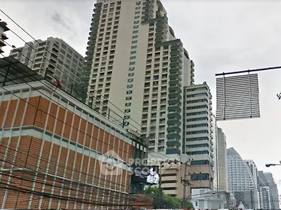 High-rise residential buildings in urban setting with modern architecture.