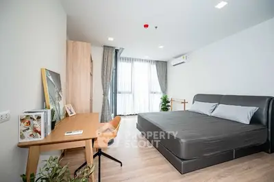 Modern bedroom with stylish furniture and natural light