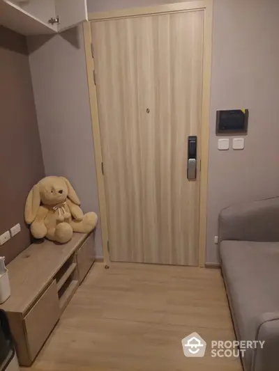 Cozy apartment entrance with security door and plush decor