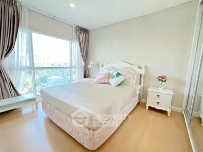 Bright and airy bedroom with large window and elegant decor