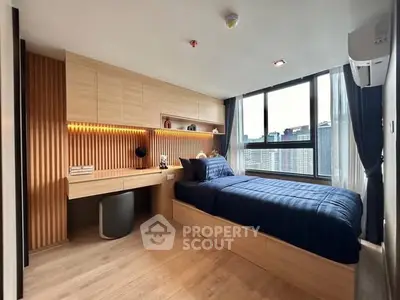 Modern bedroom with city view, featuring sleek wooden furniture and ambient lighting.