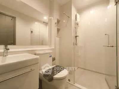 Modern bathroom with sleek design and glass shower enclosure