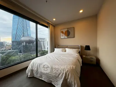 Modern bedroom with stunning city view and contemporary decor