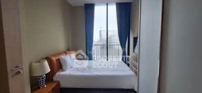 Modern bedroom with balcony view and stylish decor