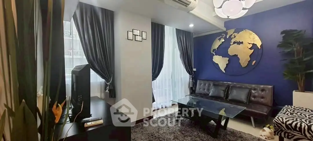 Stylish living room with world map decor and modern furniture