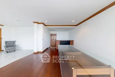 Spacious living room with elegant wooden flooring and modern design