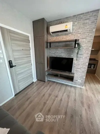 Modern living room with stylish TV setup and air conditioning