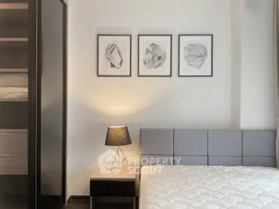 Modern bedroom with stylish decor and ample storage space