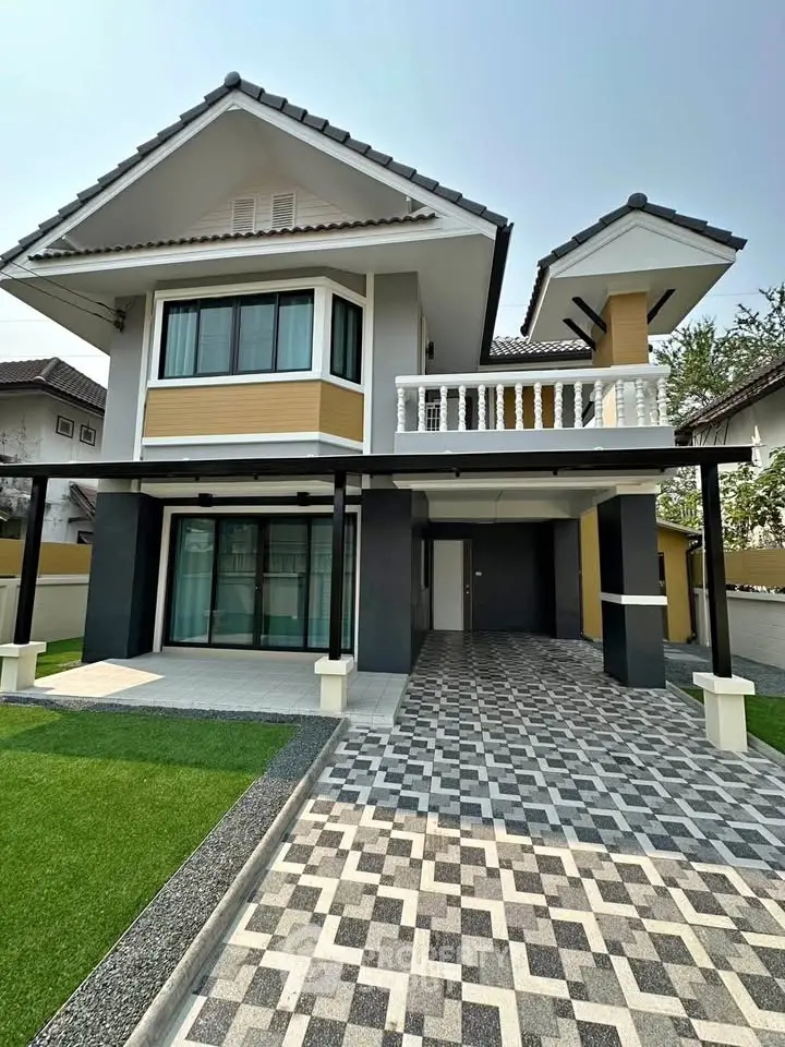 Modern two-story house with spacious driveway and manicured lawn in a serene neighborhood.