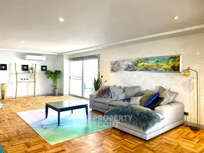 Spacious modern living room with stylish decor and parquet flooring