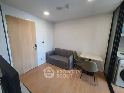 Cozy living room with modern furniture and compact design, perfect for urban living.