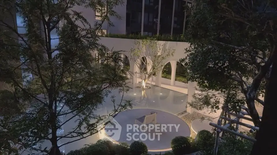 Stunning modern courtyard with elegant lighting and lush greenery