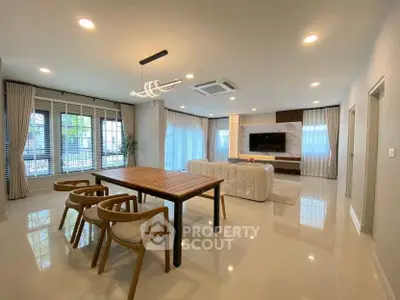 Spacious modern living room with elegant dining area and stylish furniture