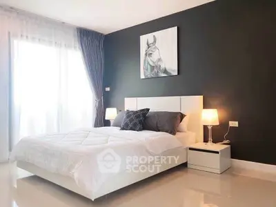 Modern bedroom with elegant decor and natural light