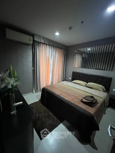 Luxurious bedroom with elegant decor and ambient lighting, featuring a plush bed and stylish furnishings.