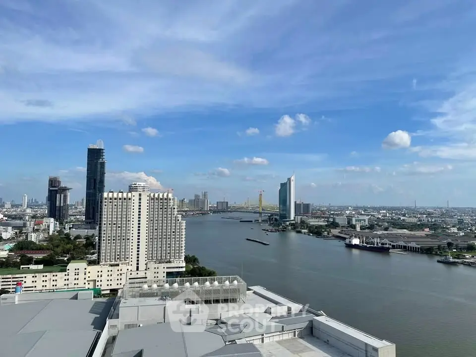 Stunning river view from high-rise building in vibrant cityscape, perfect for urban living enthusiasts.