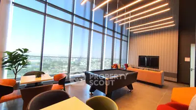 Luxurious high-rise living room with panoramic city views and modern decor