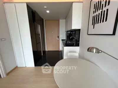 Modern studio apartment with sleek kitchen and stylish decor