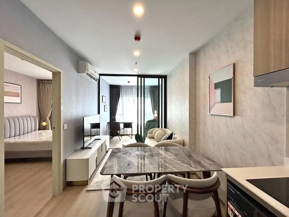 Modern open-plan living room with stylish decor and natural light