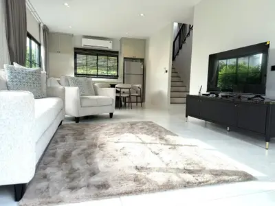 Spacious modern living room with elegant furniture and natural light