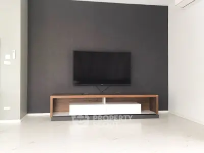 Modern living room with sleek TV stand and minimalist decor
