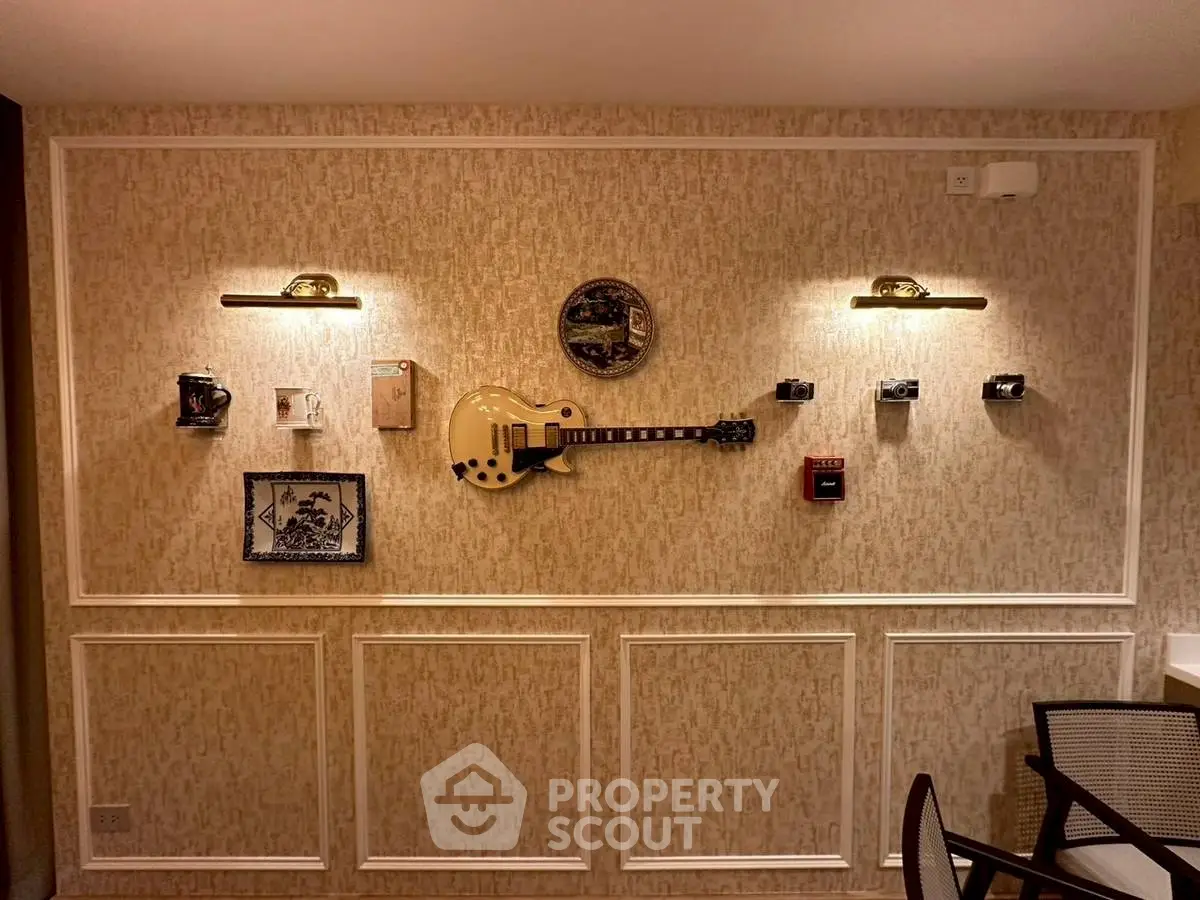 Stylish interior wall with guitar and art decor in modern living space