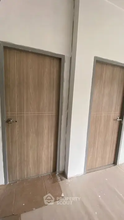 Modern interior doors in a newly constructed building hallway