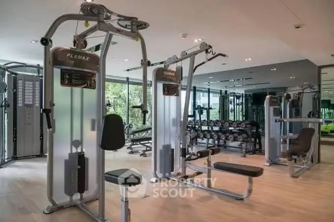 Modern gym with state-of-the-art fitness equipment in a residential building.