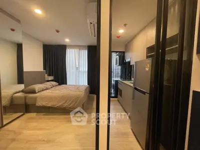 Modern apartment interior with cozy bedroom and sleek kitchen design