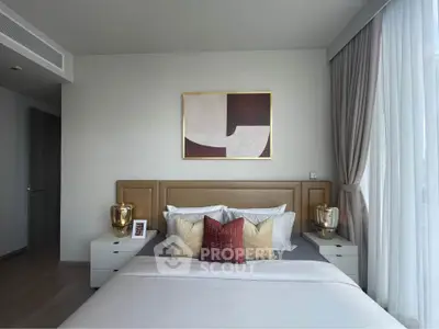 Luxurious bedroom with modern decor and large window for natural light