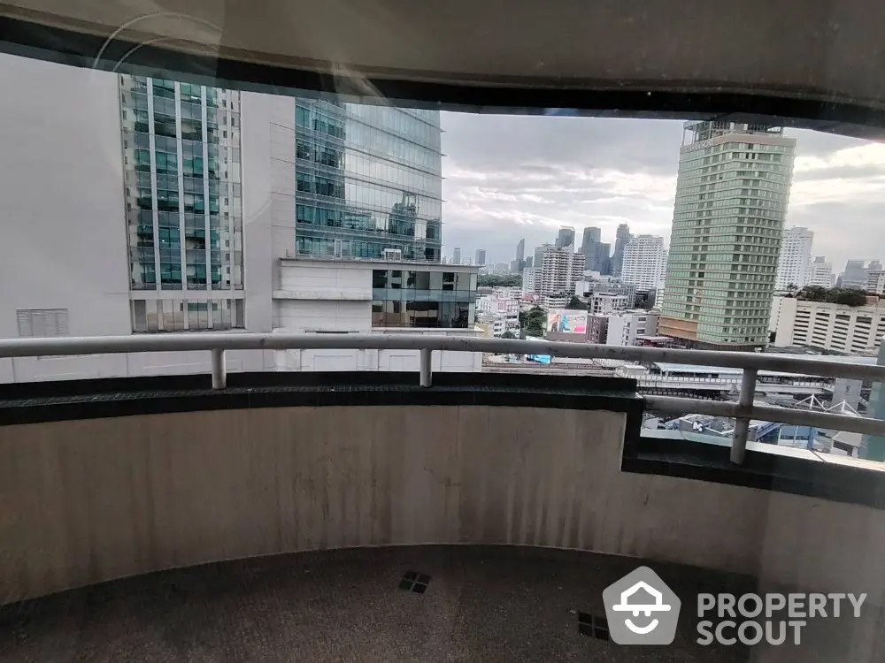 Stunning cityscape view from a high-rise balcony, perfect for urban living enthusiasts.