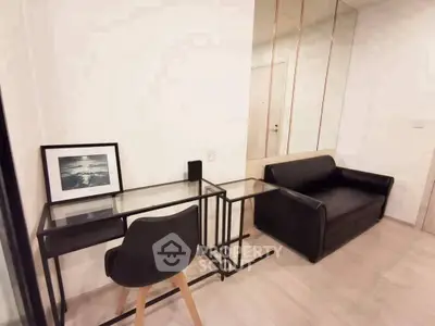 Modern study area with sleek black furniture and minimalist decor in a stylish apartment.