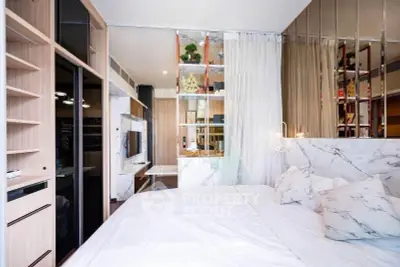 Luxurious modern bedroom with marble accents and built-in storage solutions