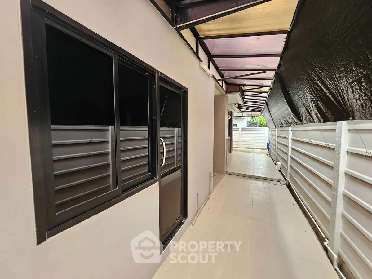 Modern exterior corridor with sleek design and ample natural light