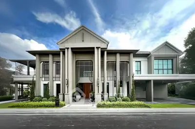 Stunning luxury mansion with grand entrance and lush landscaping