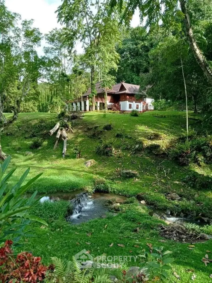Charming countryside home surrounded by lush greenery and serene landscape