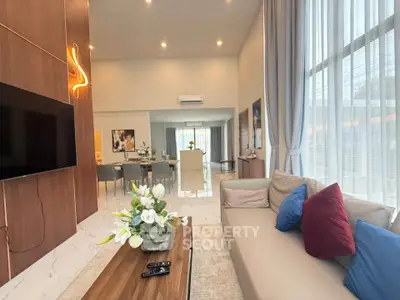 Spacious modern living room with high ceilings and elegant decor